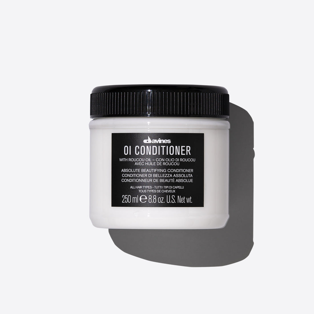 Oi Conditioner by Davines, 250ml jar, with Roucou oil for nourishing and moisturizing all hair types. Absolute beautifying conditioner for healthy, shiny hair.